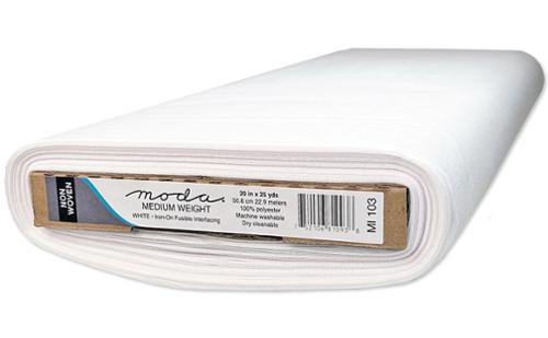 Bolt of white Moda medium-weight iron-on interfacing, shown end-on with its label.