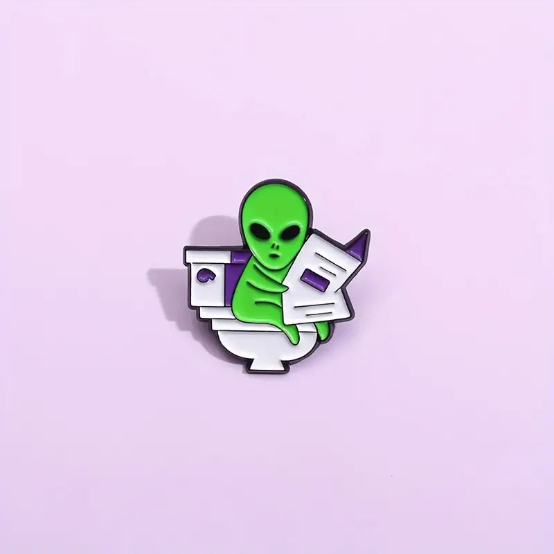 Alien Reading Newspaper enamel pin