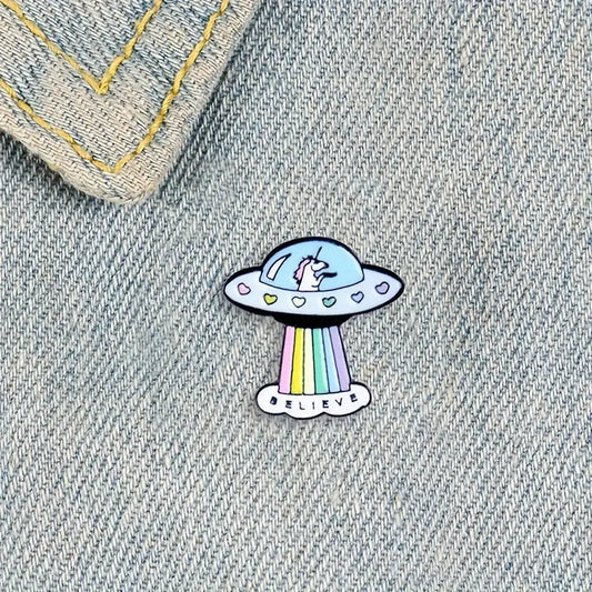 unicorn spaceship with rainbow beam enamel pin